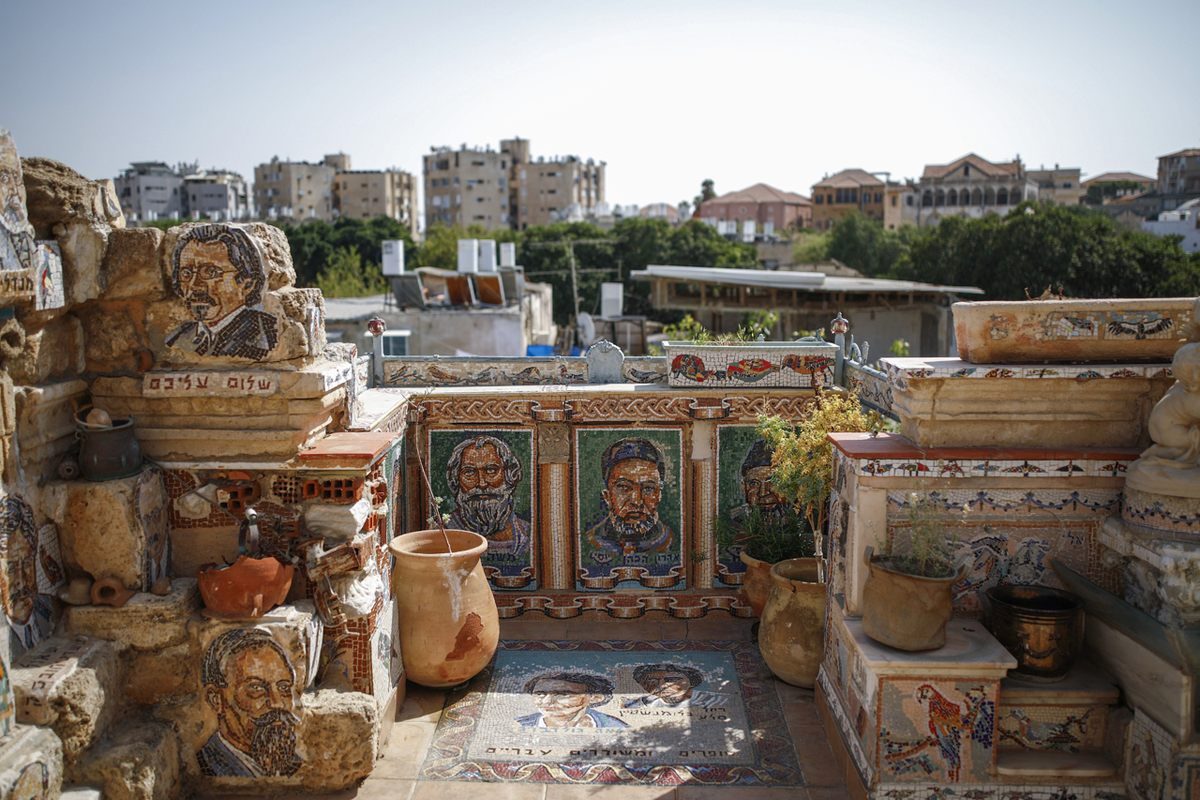 Tile portraits have spilled onto the roof.