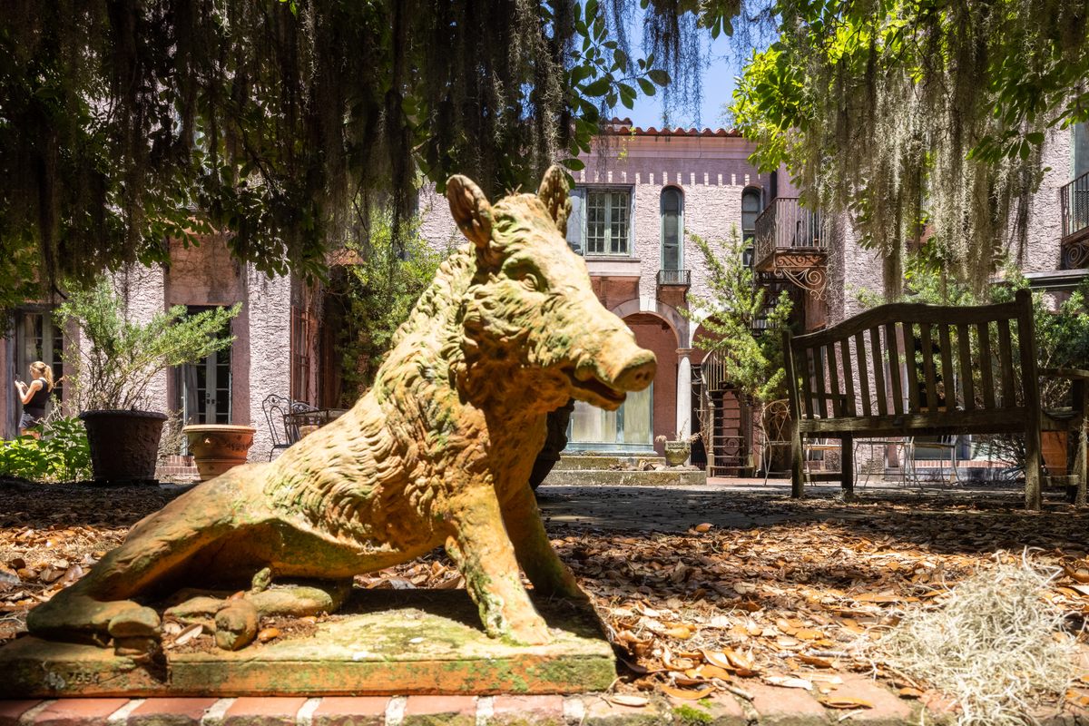 A statue of an Ossabaw hog outside of Sandy West's mansion.