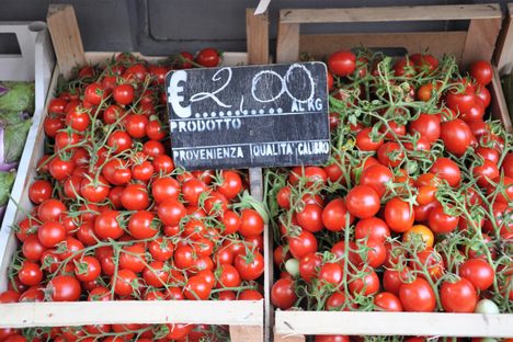 Tomatoes for sale at a market stall in Italy.