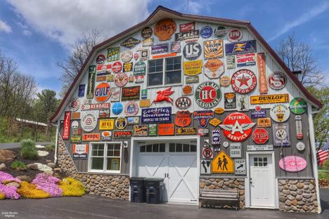 The exterior of the barn is also covered with signs.