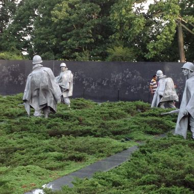 Wall behind soldiers. 