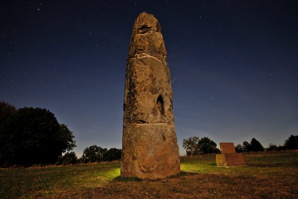 The menhir is particularly impressive at night.