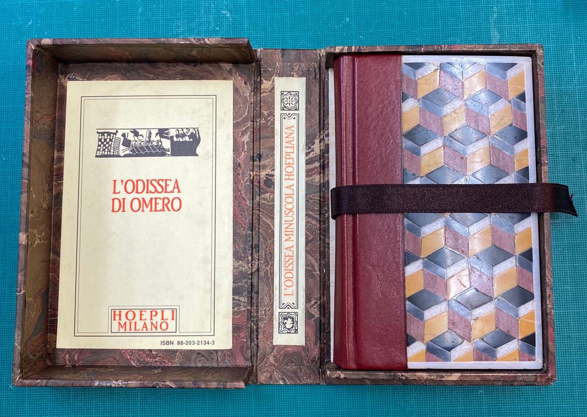 Olbi made the cover of this pocket edition of Homer’s <em>Odyssey</em> made with pebbles from Saint Mark’s Cathedral. 