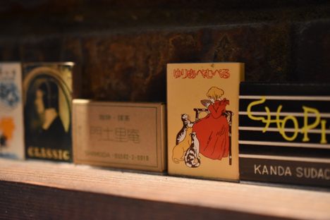 Matchboxes adorn the wall.