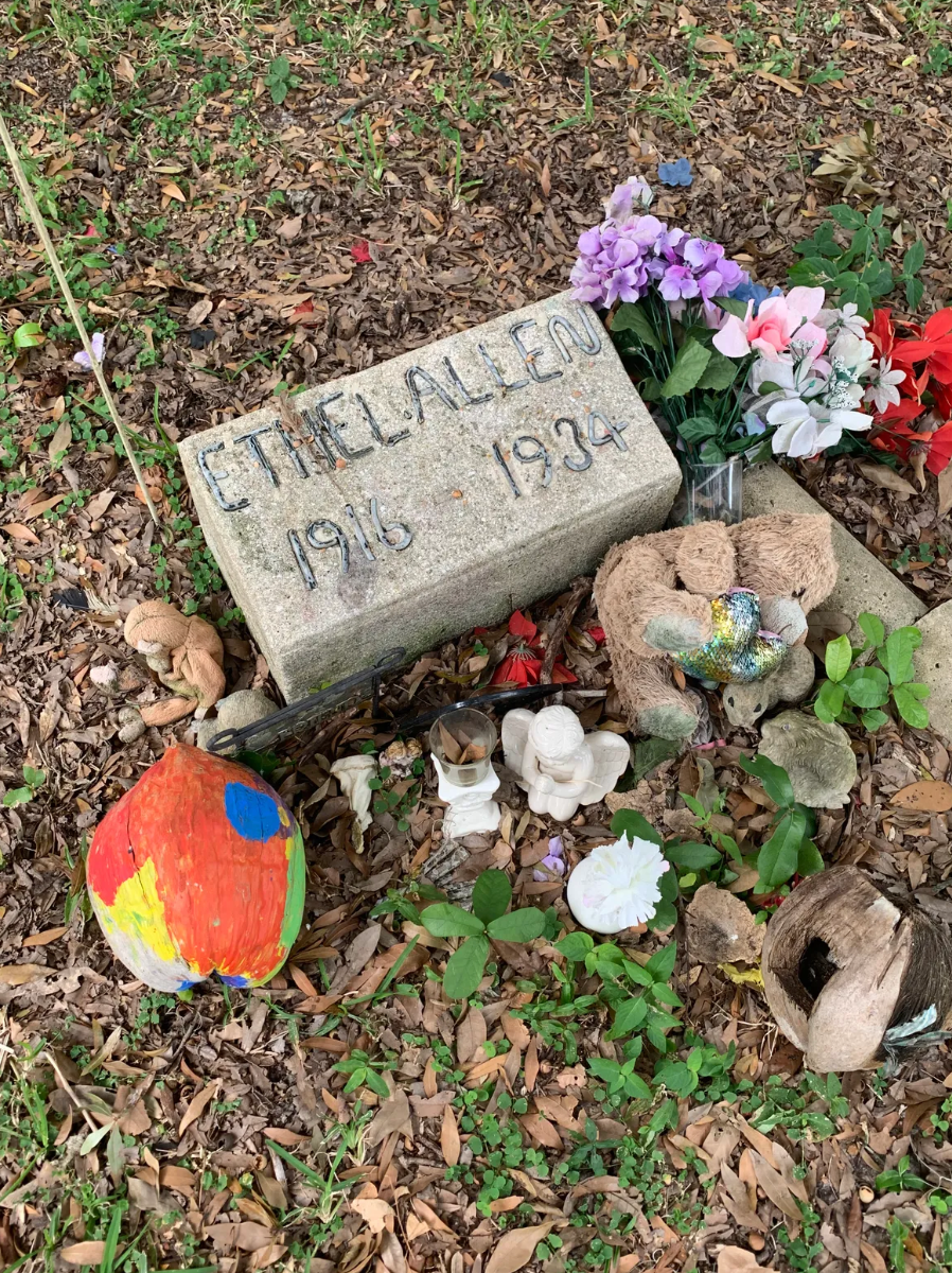Ethel’s handmade headstone has been decorated with flowers, angel figurines, stuffed animals, and more. 