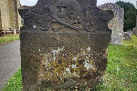 The grave of the pirate, on the right of the path near the church