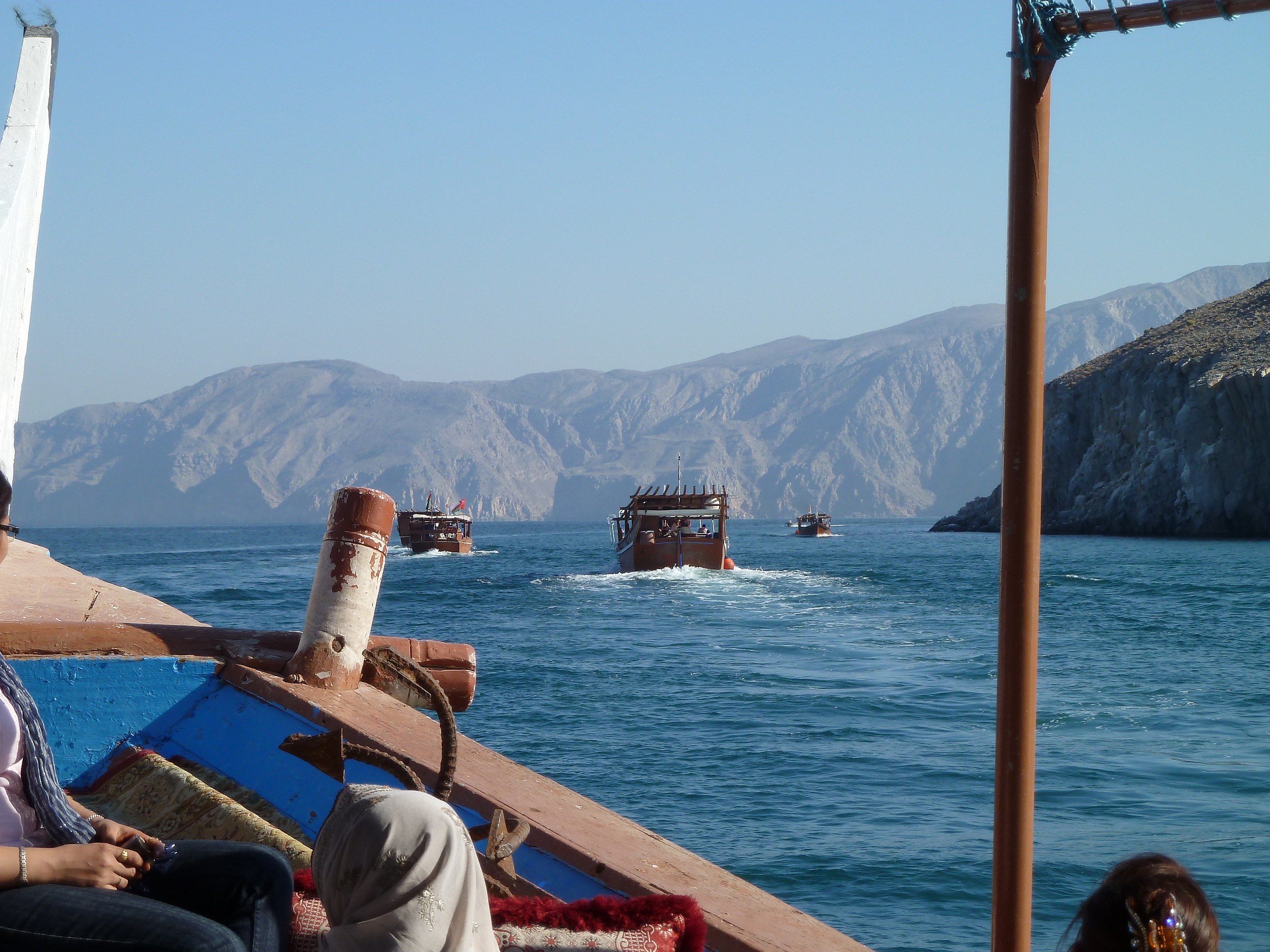 Ships traveling through the khors of Oman's Musandam Peninsula.
