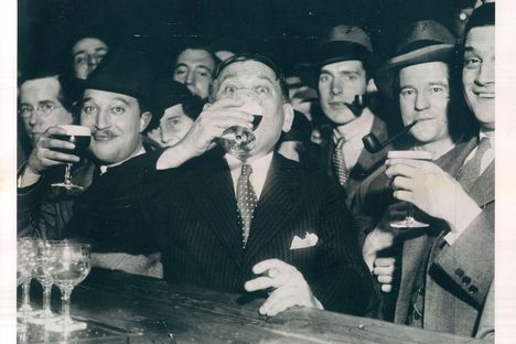 H.L. Mencken drinks his first swig of legal beer at Baltimore's Rennert Hotel on April 7, 1933.
