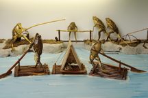 Taxidermied frogs spend a day on the lake at Froggyland