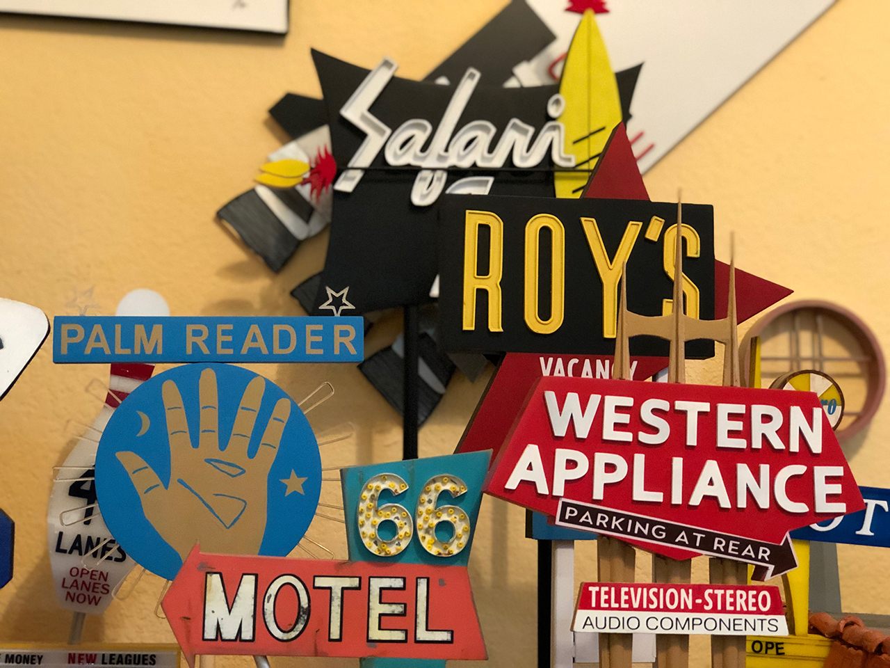 Chris Raley makes these miniature models of vintage signs in his Fresno workshop. 