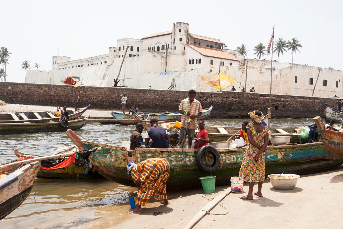 Fishermen in the shadow of Elmina Castle.