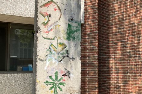 One side of the wall has signs of spray paint.