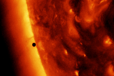 Mercury, an "empty little rock," appears as a small black dot as it crosses in front of the Sun.