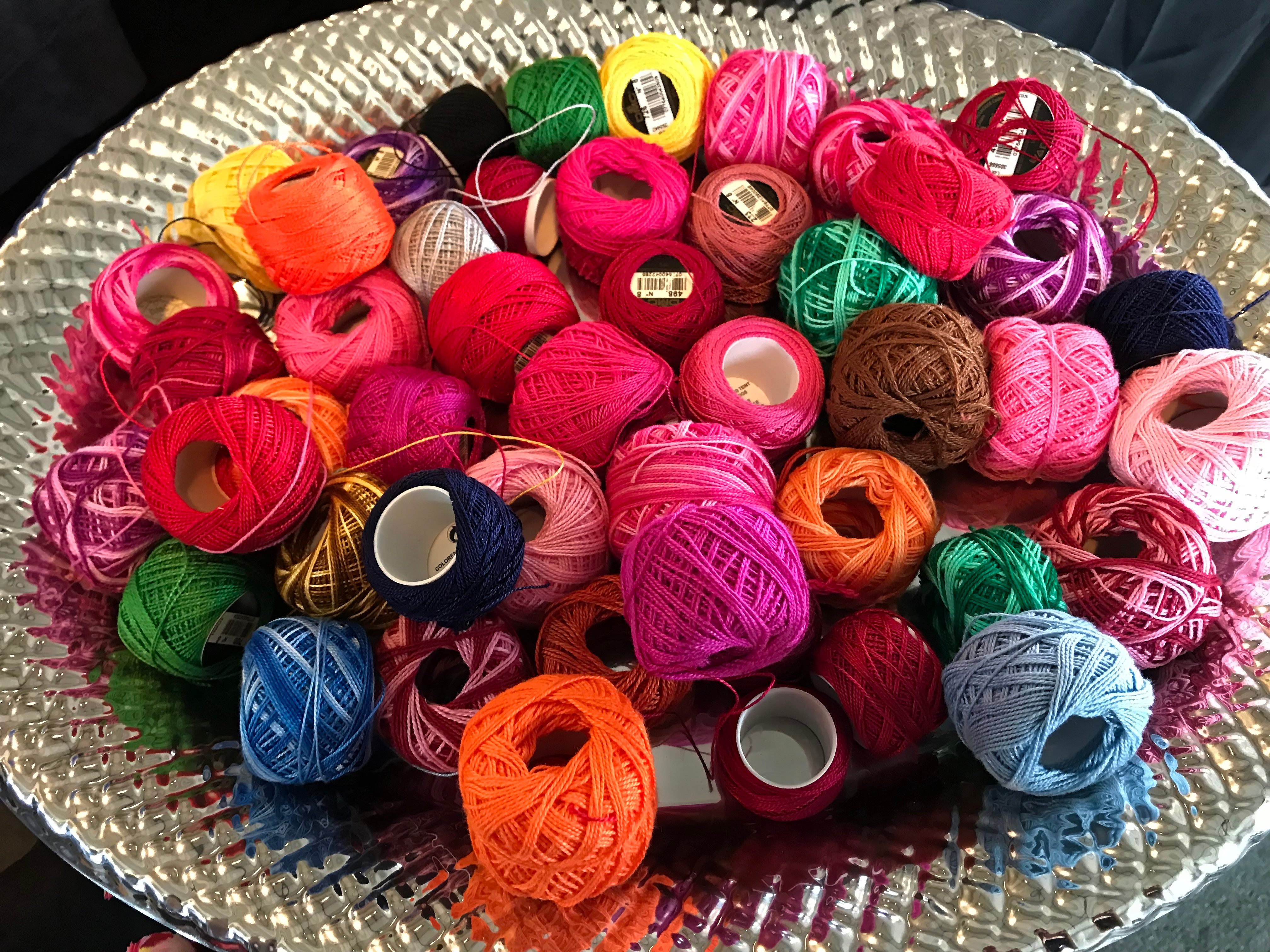 A pile of brightly colored thread, waiting to be embroidered.