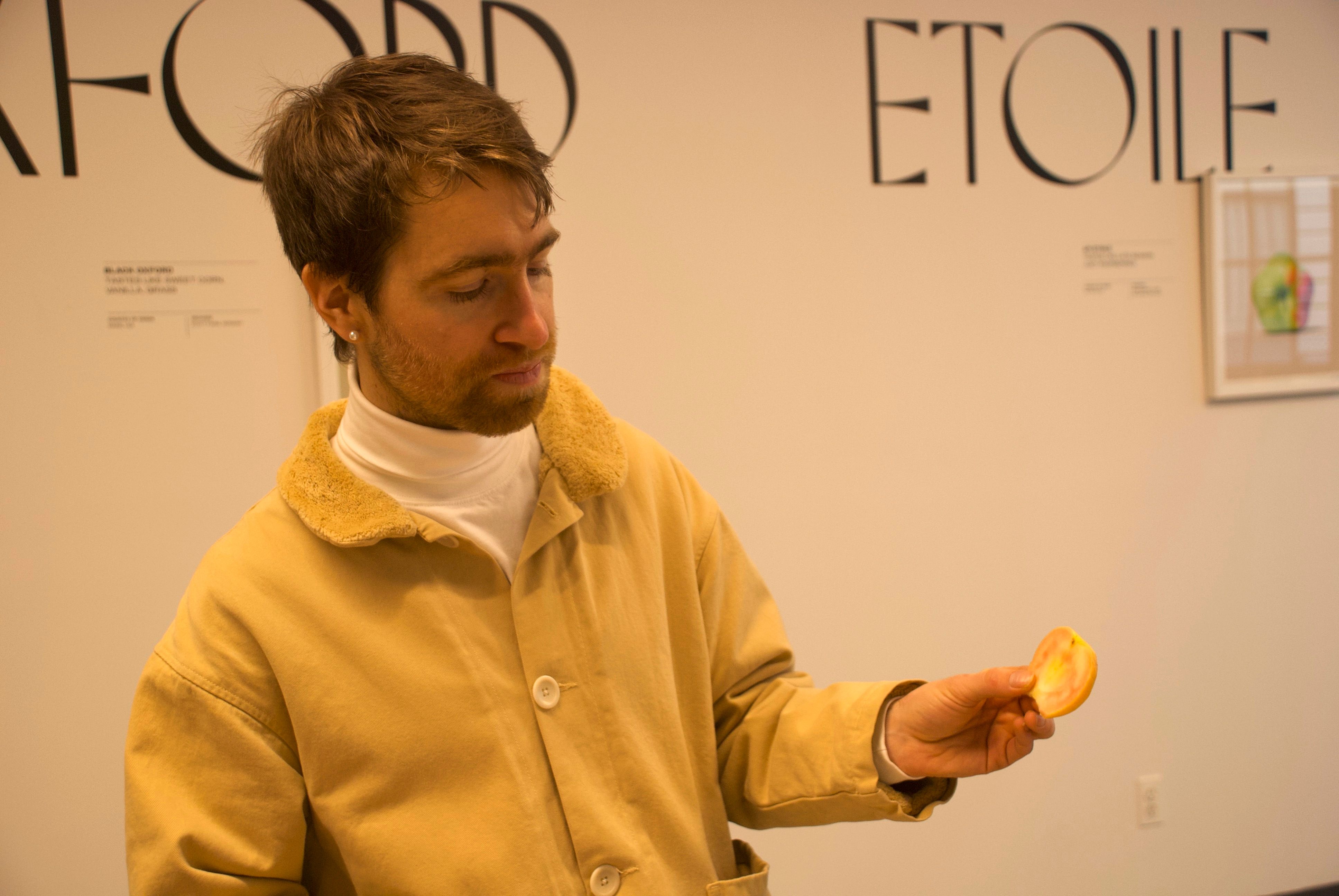 Mullan gazes at the interior of a red-fleshed apple.