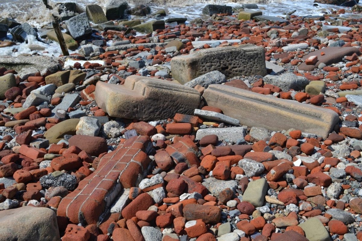 The assemblage includes single bricks to intact chunks of wall to large pieces of masonry.