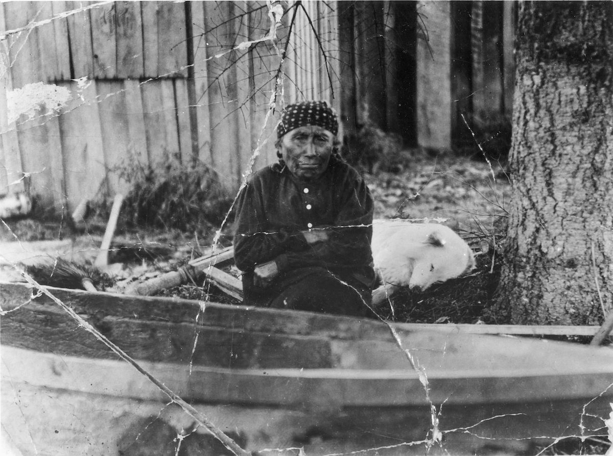 Mary Adams and her dog Jumbo, one of the last living Coast Salish woolly dogs