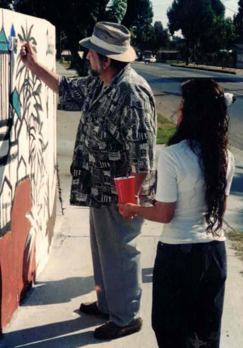 O'Cadiz painting the Raitt Street mural in 1994.
