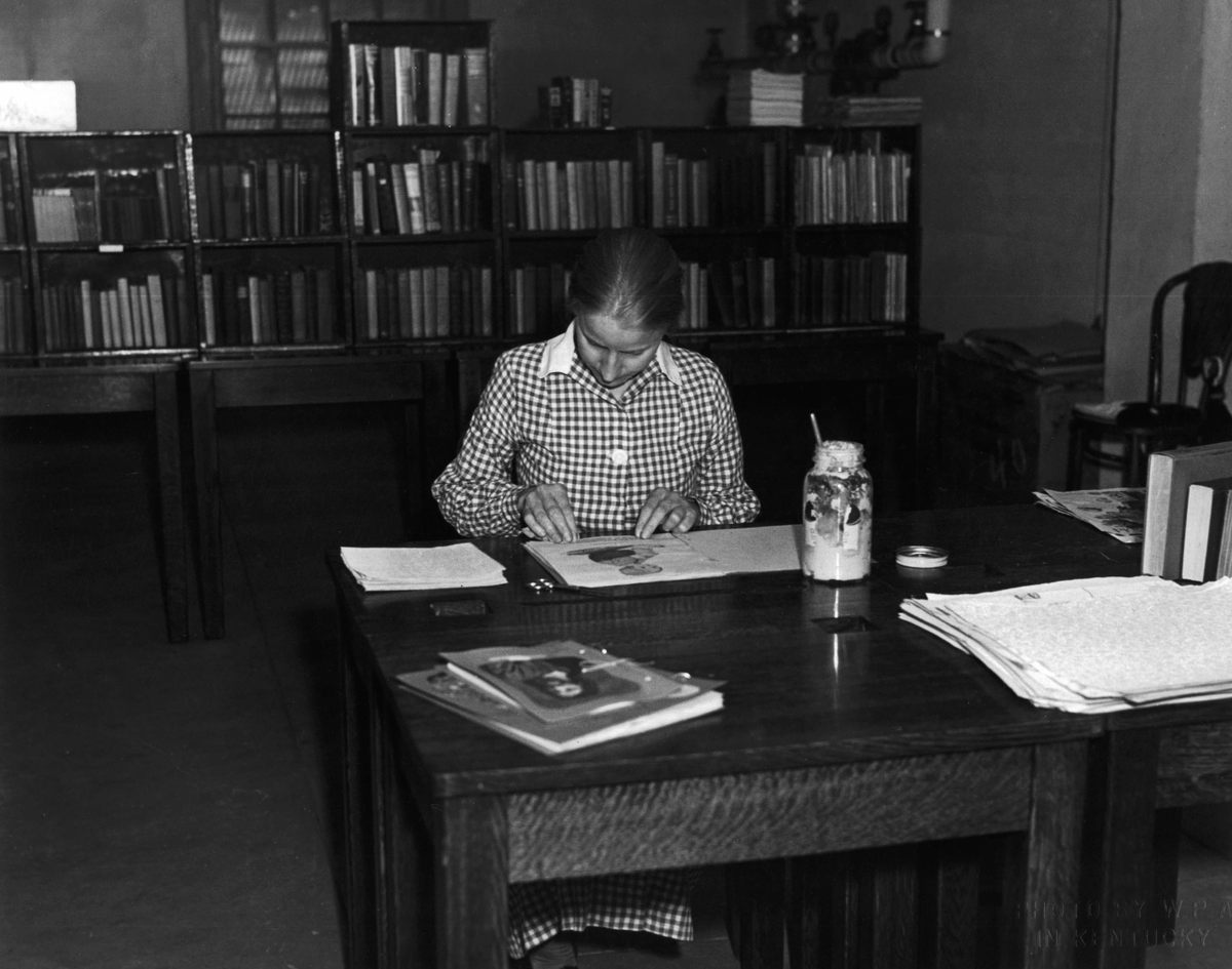 Making a scrapbook, c. 1940.