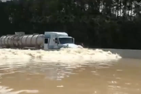 Watch a Mysterious Video of a Truck Driving Through an Interstate Flood