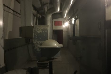 A door that heads to the surface at a ventilation shaft