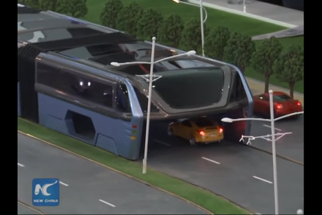 Watch This Elevated Bus Swallow Cars and Straddle Roads