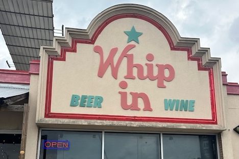 The exterior of Whip In.