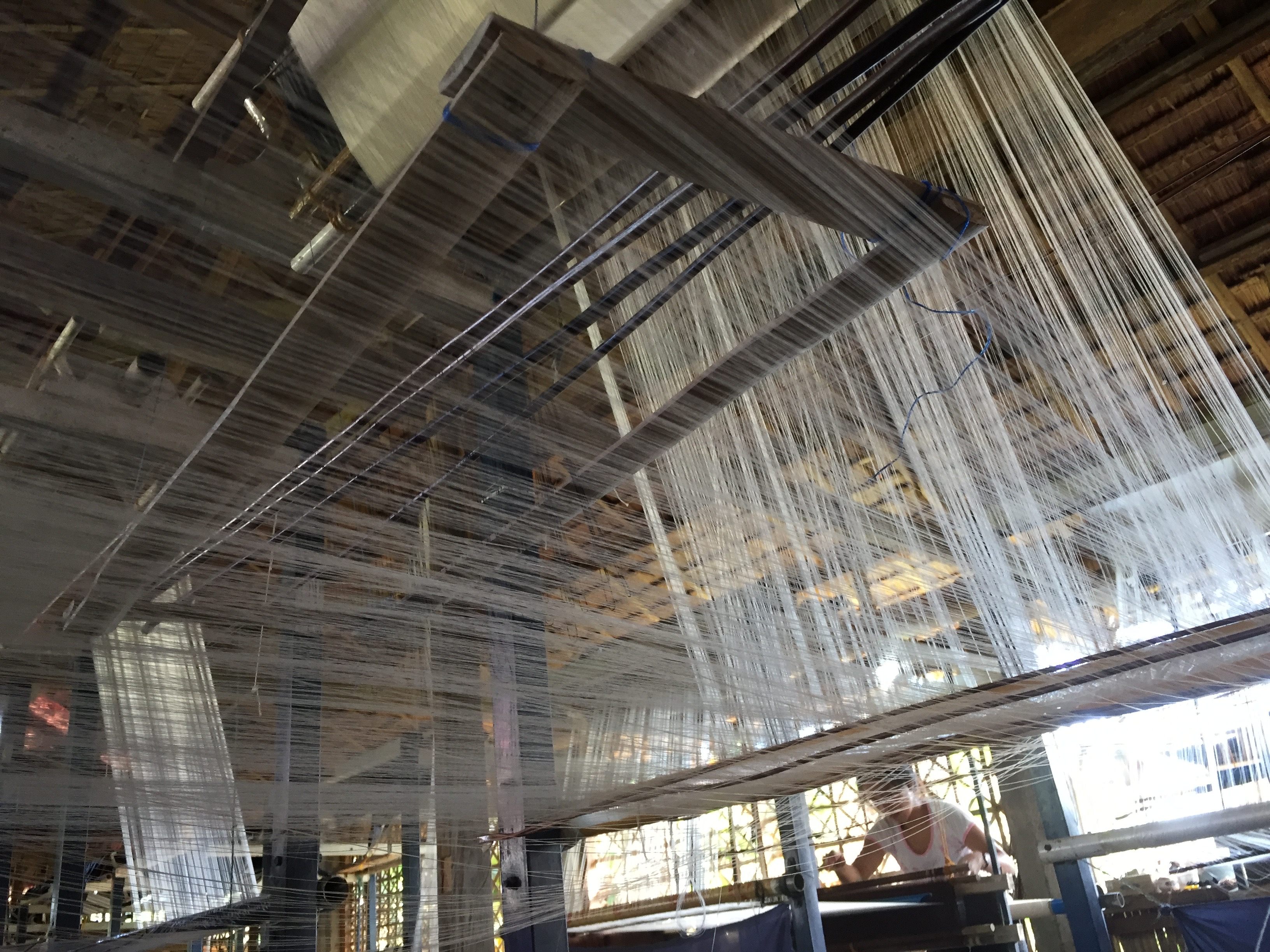 A floor loom for weaving piña inside a weaving cooperative.