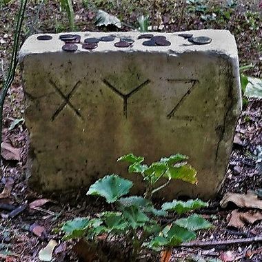 The small stone often has coins and other offerings left by visitors.