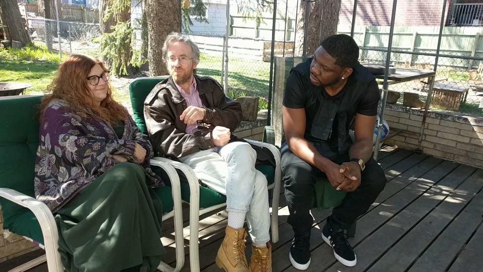 Maurice Perkins (right) converses with Jon and Paula Silverstein (left).