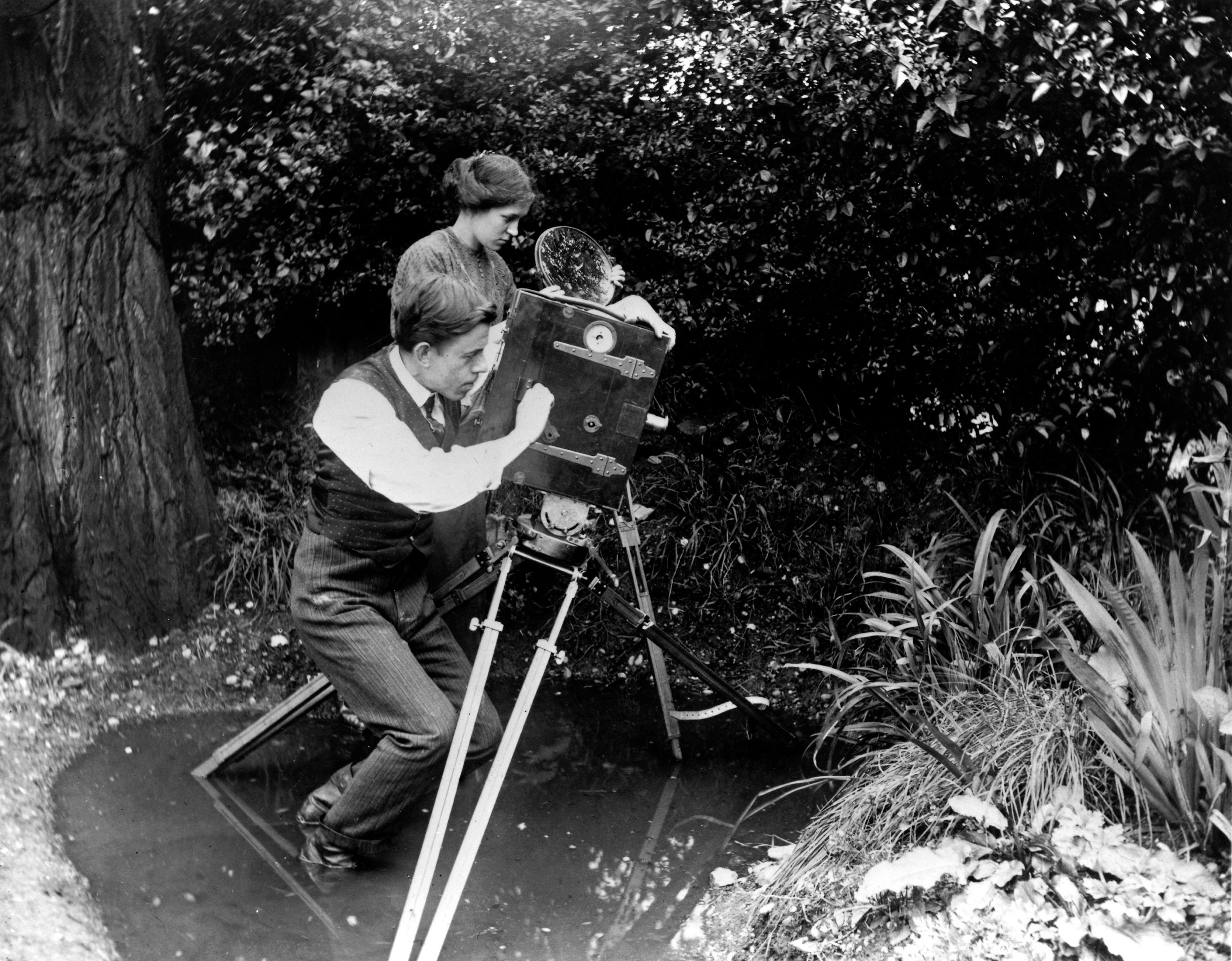 The pioneer filmmaker capturing a pond, c 1910.