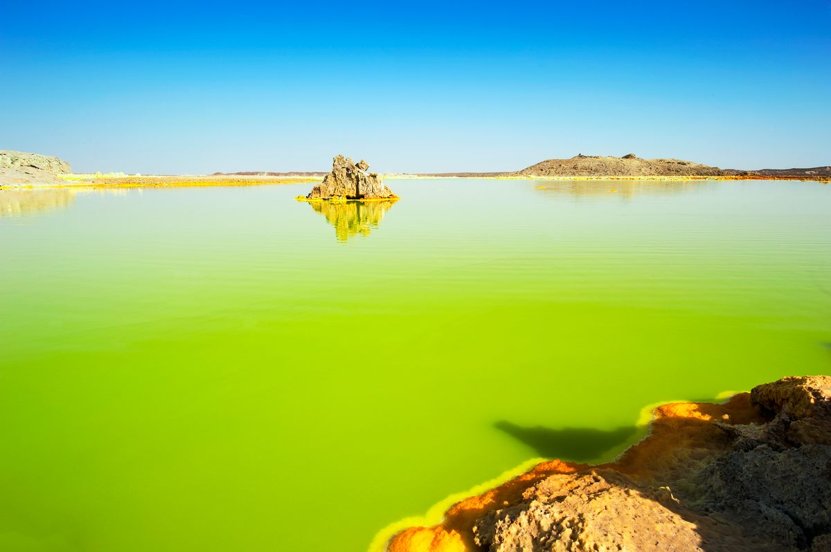 A water-filled eruption crater at Dallol.