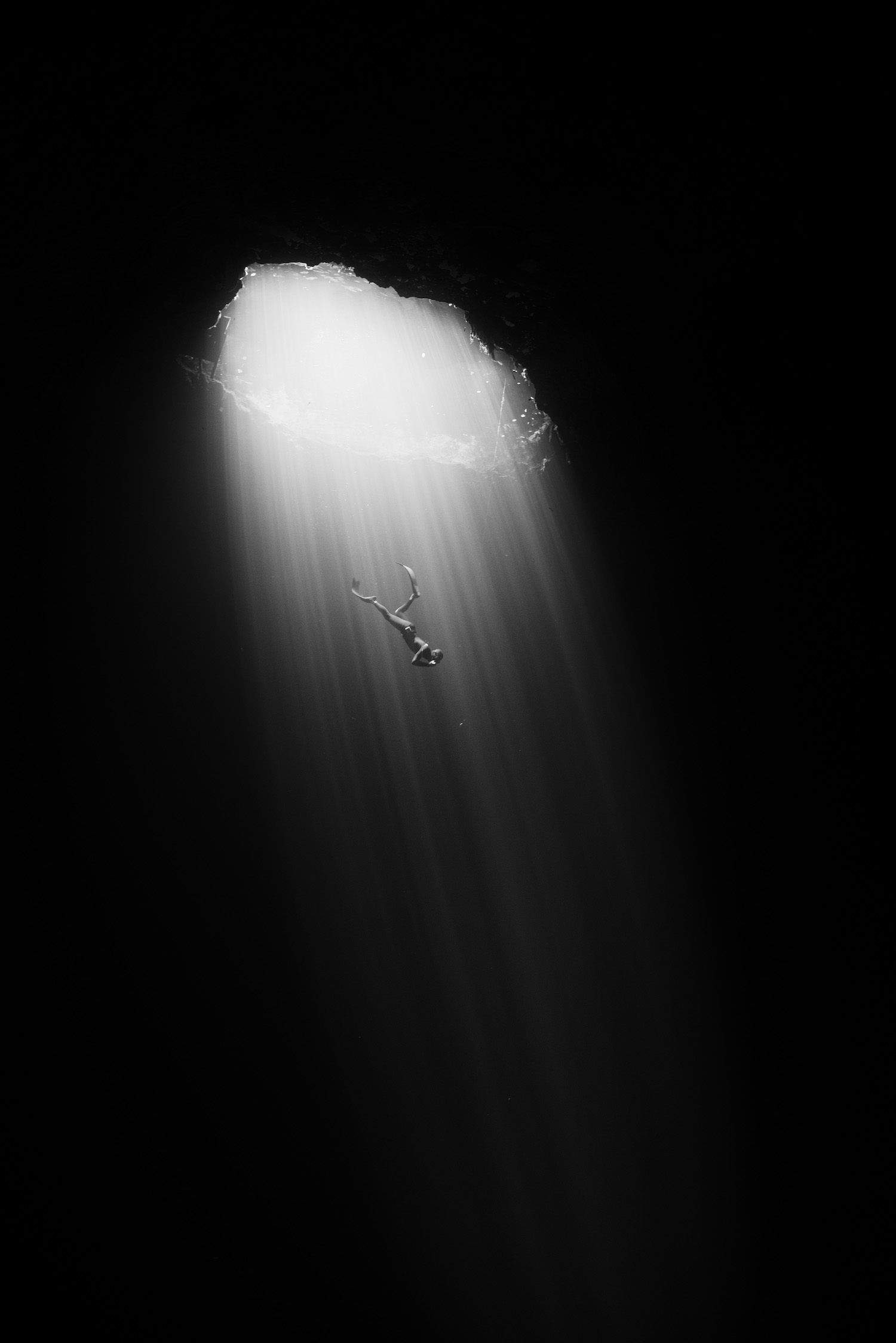 <em>Cenote II</em>, showing a free diver descending into a cenote in the Yucatan Peninsula.