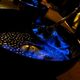 A brilliant blue bowl of queimada on fire. 