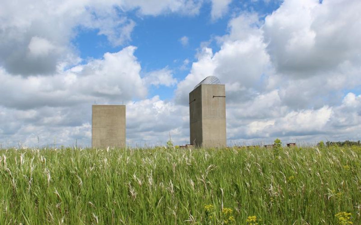 The missile site rises dramatically from the fields that surround it.