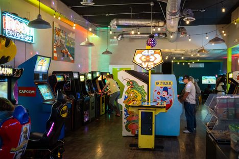 The game selection includes classics like Ms. Pac Man, Galaga, and Q*Bert, as well as newer games llike Pac Man Battle Royale.