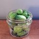 A jar of cucamelons, ready to be brined into pickles.