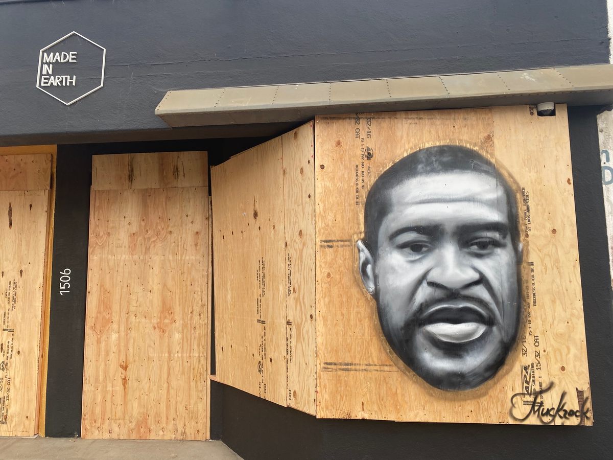 Jules Muck has completed dozens of paintings all over Los Angeles to show support for victims of police brutality, and for the protesters who have been demonstrating for weeks. Muck often paints the faces of Black victims of police violence. This one honors George Floyd.