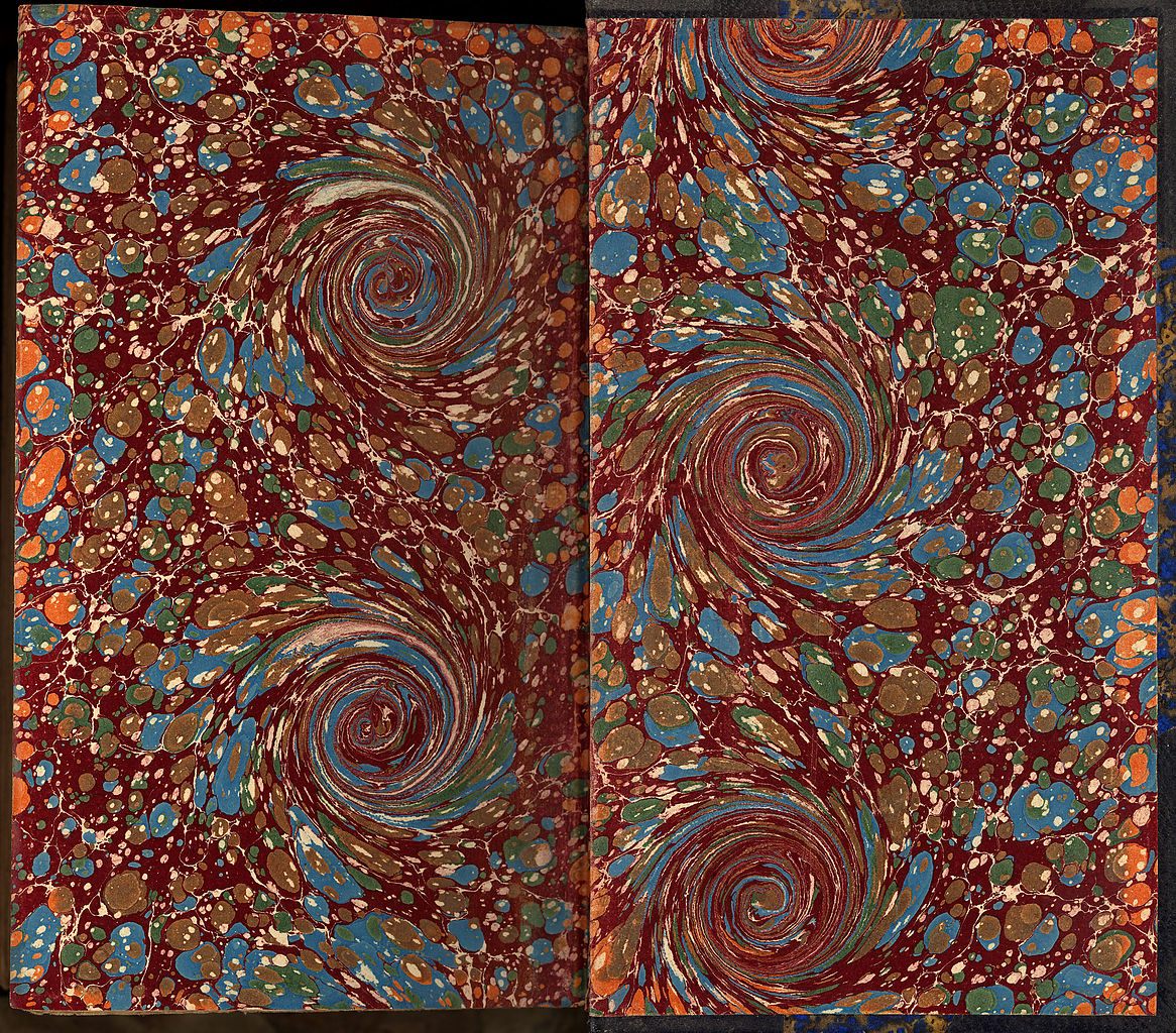 Handcrafted marbled endpapers of a book manually bound in France around 1880.