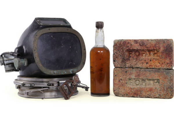 The full auction lot includes original bricks from the ship and a diving helmet.
