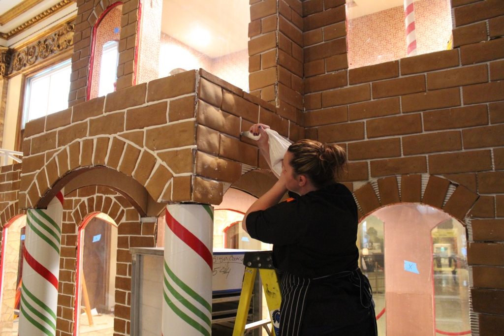 Royal icing is piped between bricks, for looks and stability.