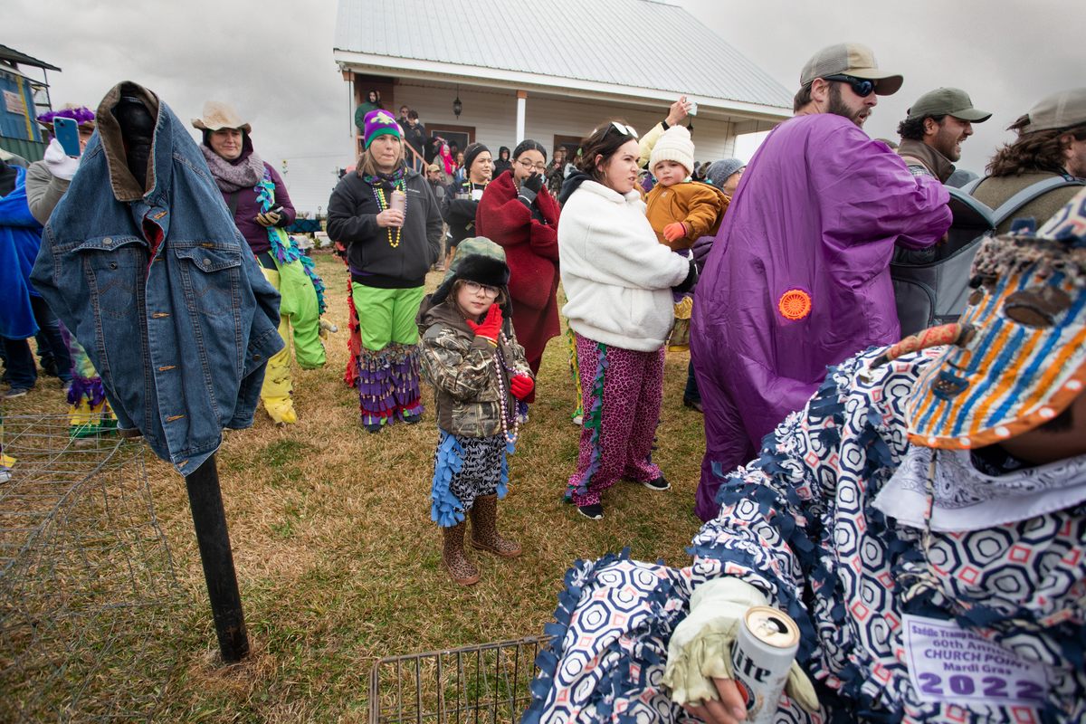 The next generation of revelers absorbs the liturgy.