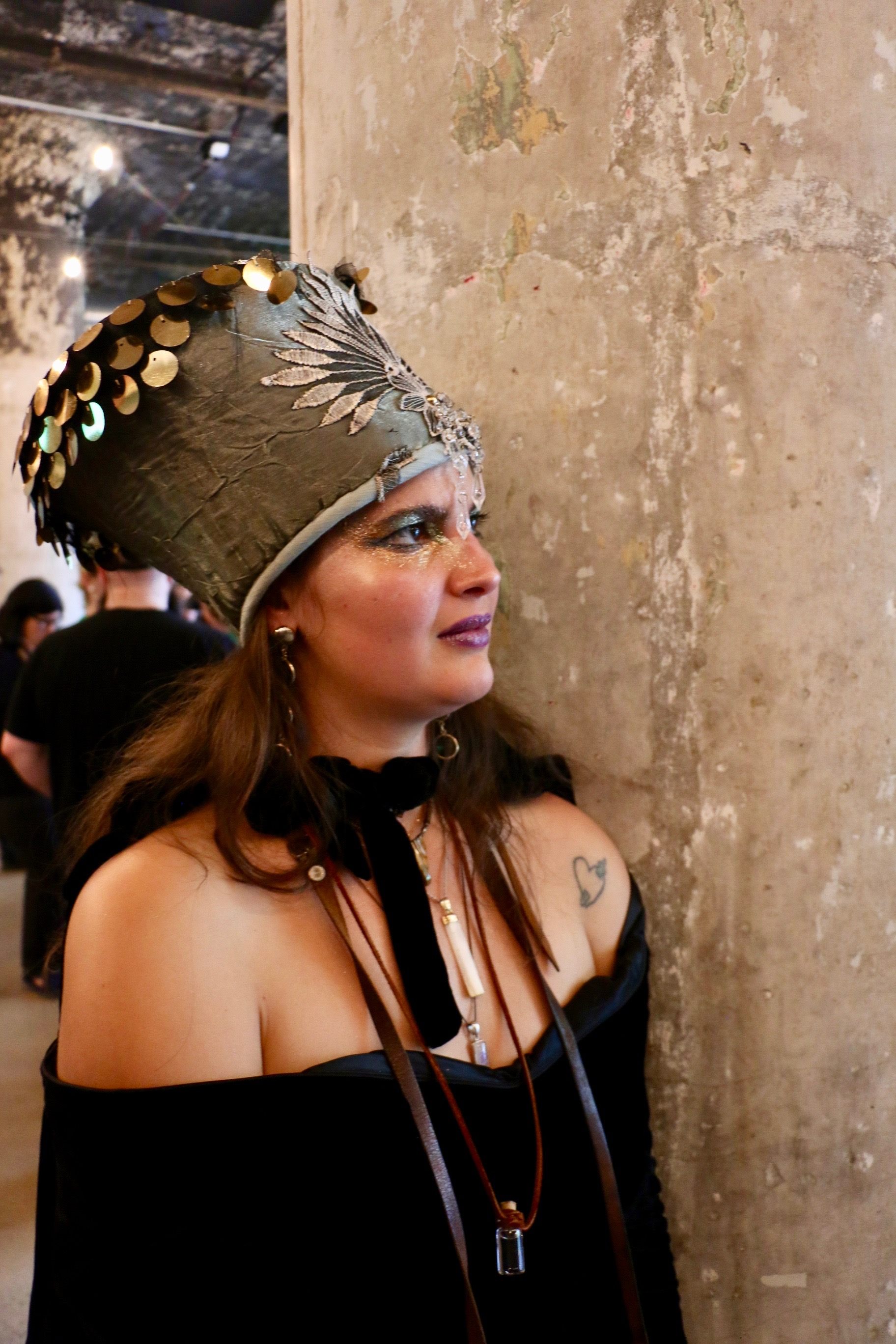 Tarot reader Gina Murdock watches the acrobats. 