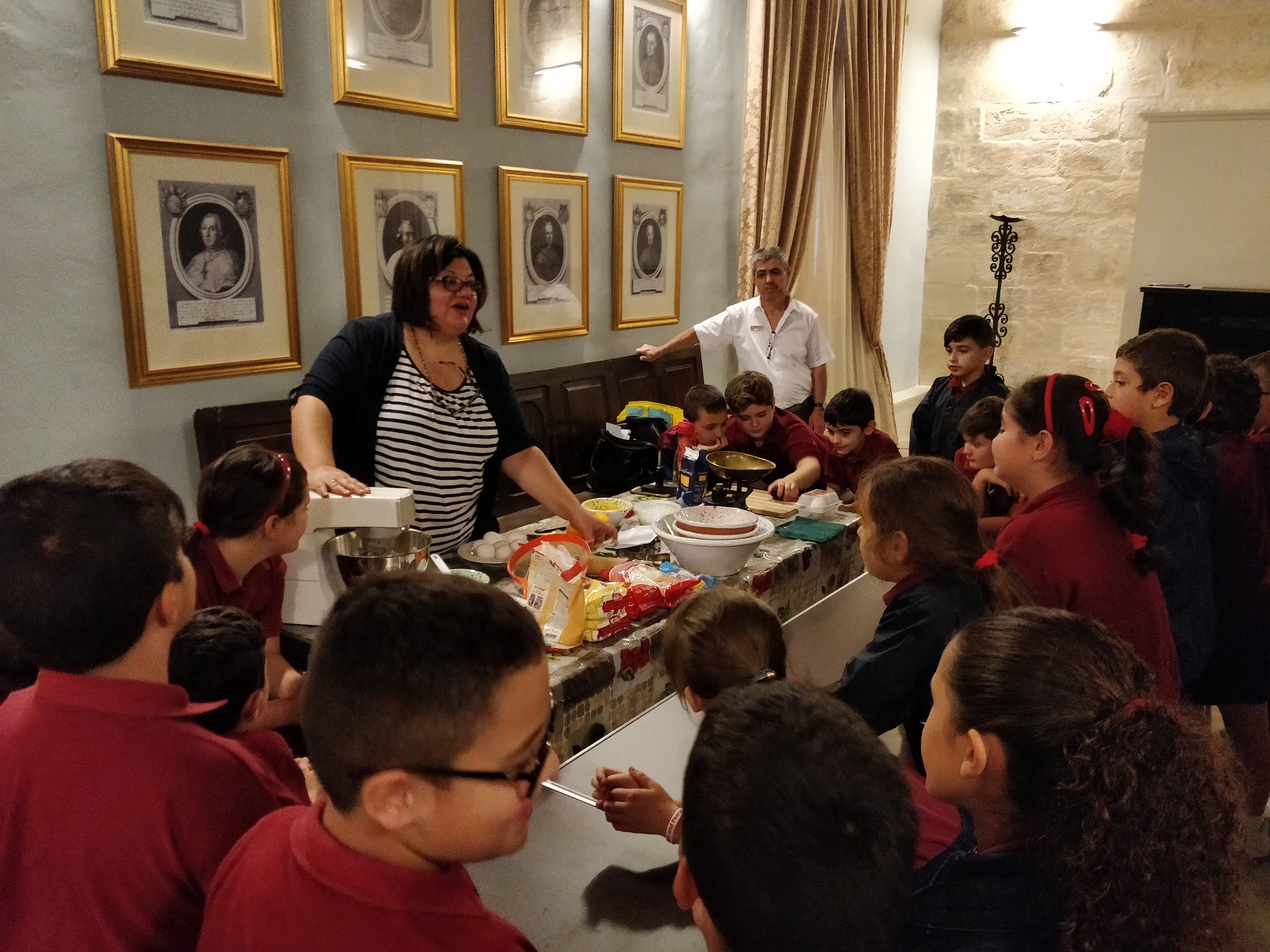 A group of students learning about November traditions at a previous Heritage Malta event.