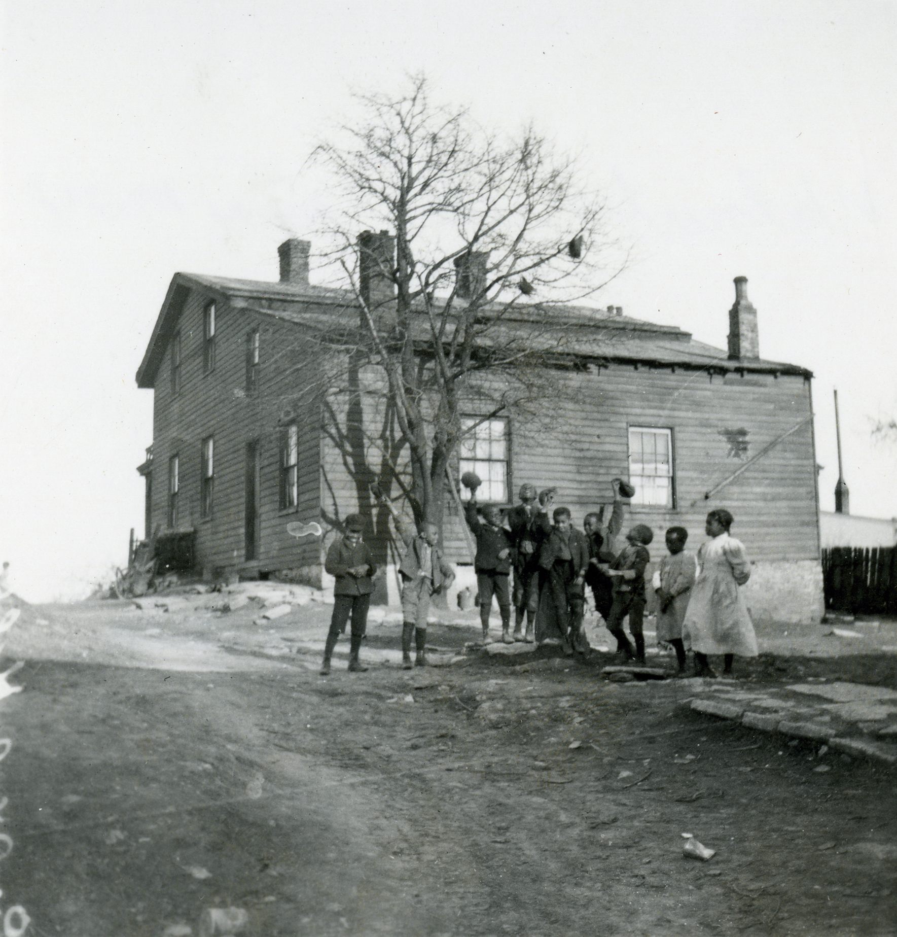 In this photo taken around 1905, African-American children pose in front of the home of Levi Coffin, a Quaker and abolitionist whose Cincinnati home is sometimes called "Grand Central Station of the Underground Railroad."