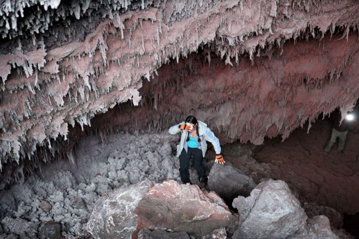Janine Krippner walks out of a hot lava tube in Kamchatka in 2015. The tube resulted from the 2012 lava flow at Tolbachik volcano.