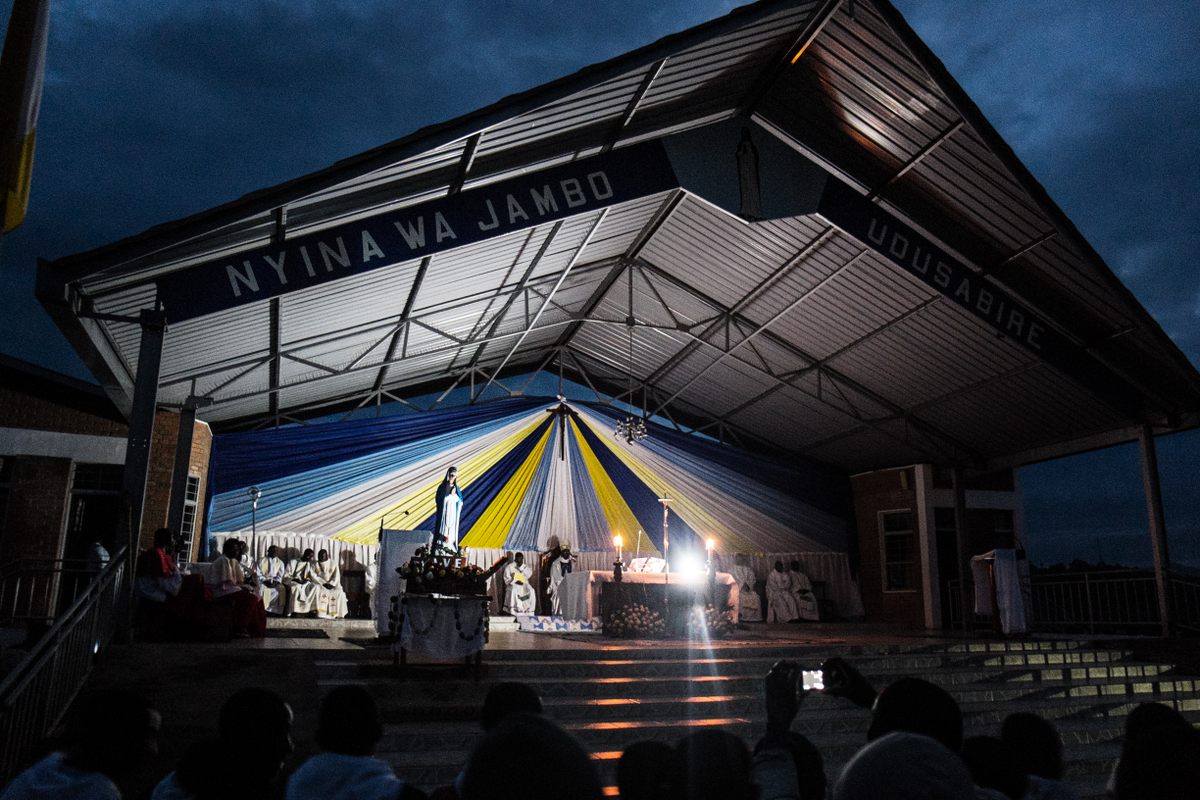 During the celebration of the Assumption of Mary, devotees pray inside the church, then attend night mass outside. They carry the statue of Our Lady of Kibeho in a procession. The mass is celebrated in a range of languages, including Luganda, Kiswahili, English, French, and Kinyarwanda.