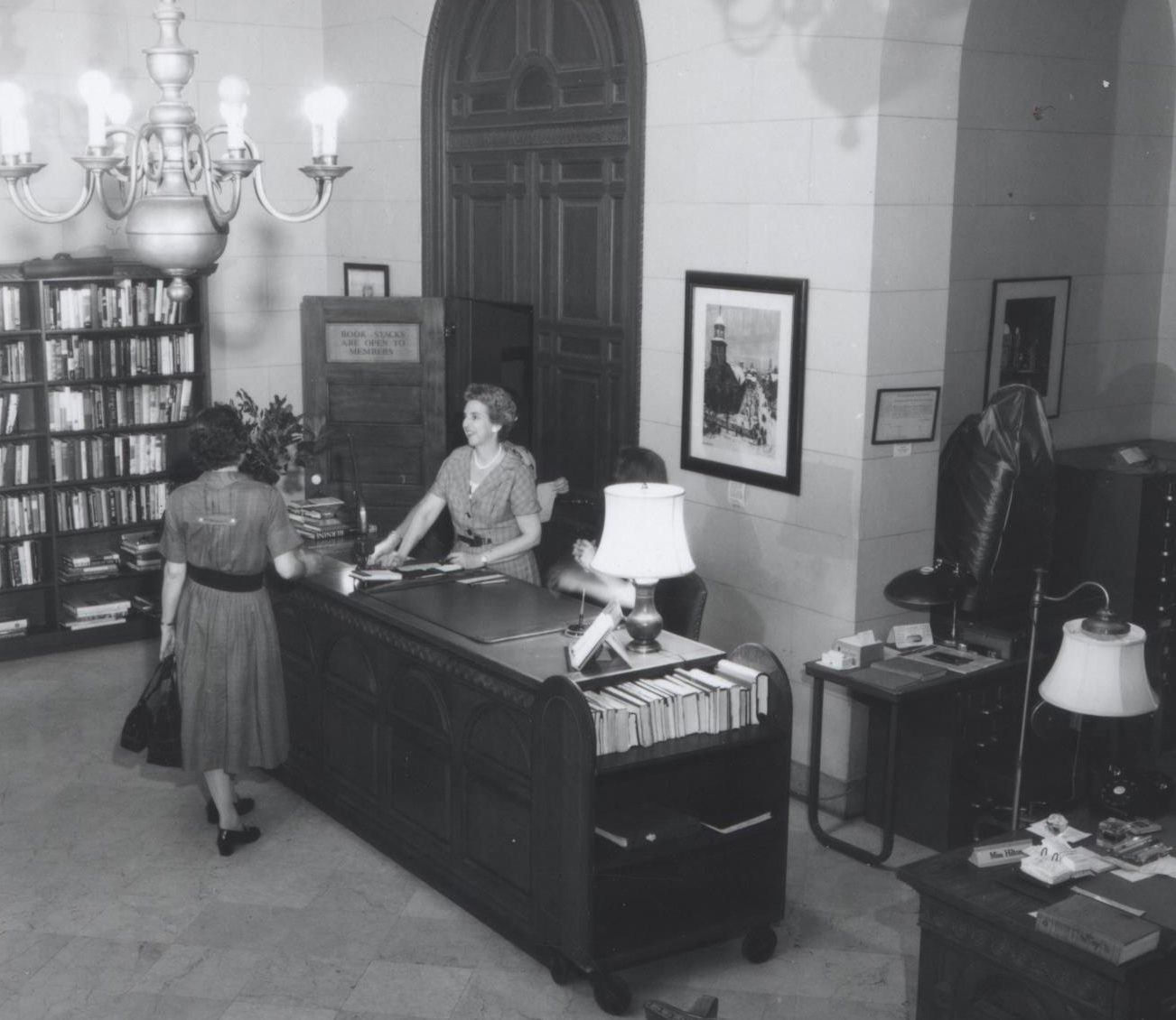 Librarian Sylvia Hilton at the Circulation Desk, c. 1953.