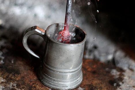 A red-hot loggerhead is thrust into a mug.