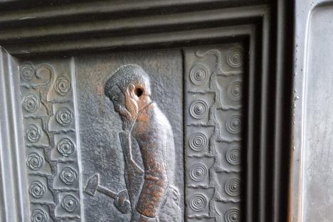 Bullet hole in the decorative panel on the external door.